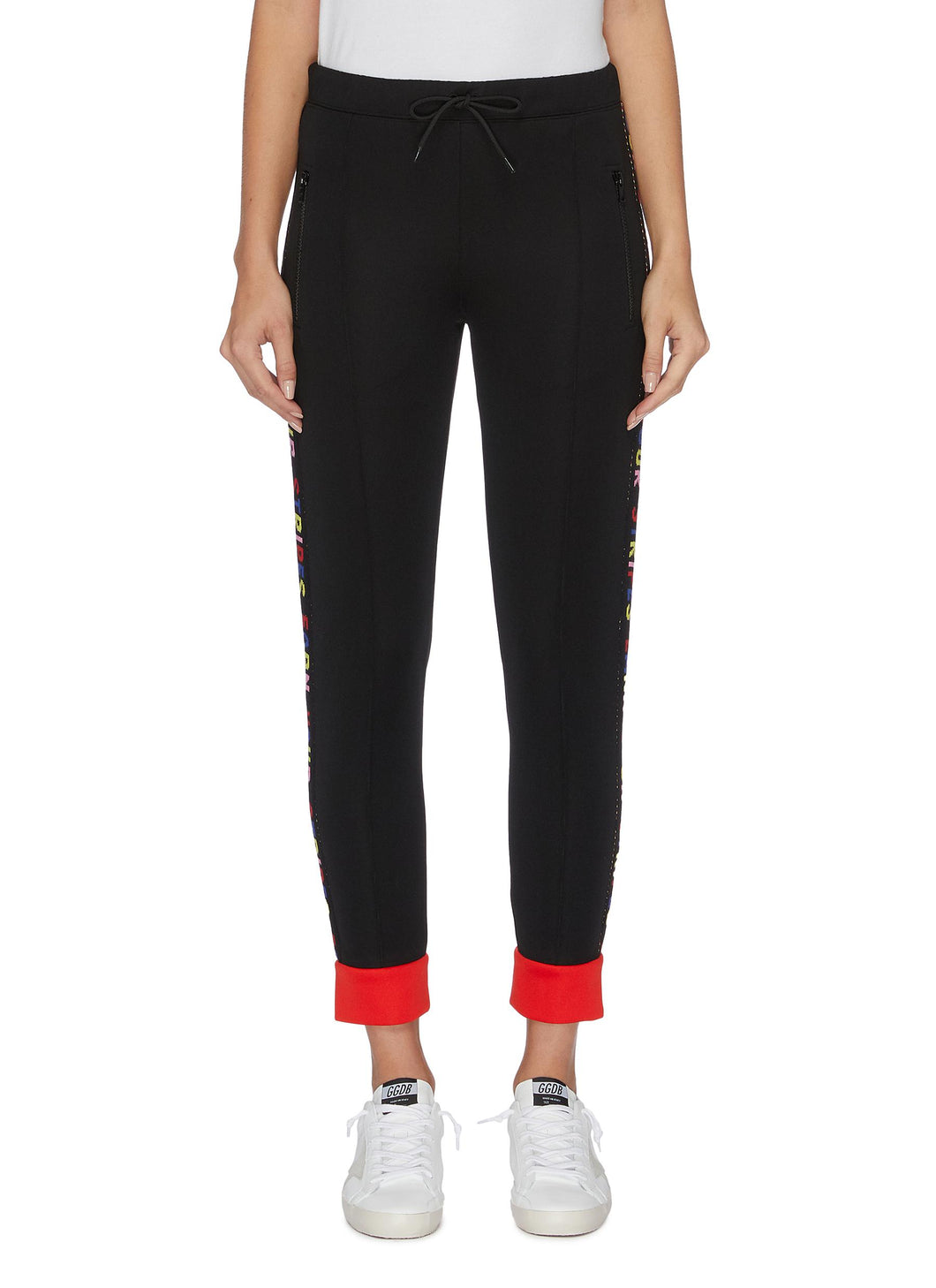 'Earn Your Stripes' slogan embroidered outseam zip cuff ribbed track pants